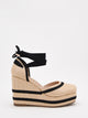 Espadrillas con zeppa, piattaforma e nastri neri.