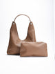Women's burgundy hobo bag with interior toiletry bag