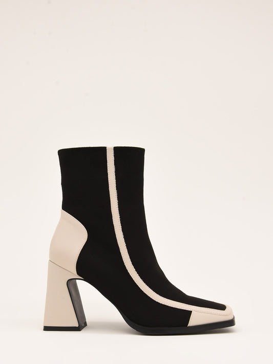 Two-tone ankle boots in black and ice with geometric design