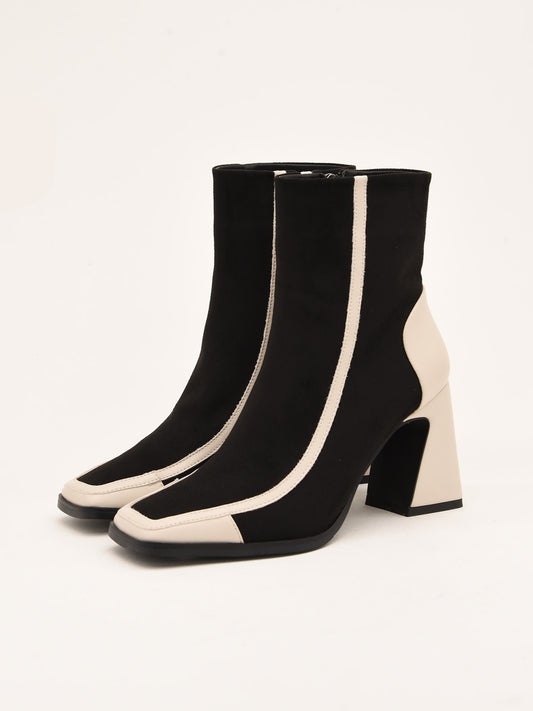 Two-tone ankle boots in black and ice with geometric design