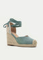 Espadrilla zeppa verde con fiocco.