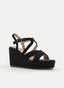 SANDALIA DE CUÑA NEGRA CON TIRAS CRUZADAS TRENZADAS