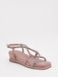 Sandalias planas color rosa y tiras cruzadas con strass