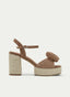 CAMEL SANDAL WITH FLOWER, JUTE, AND WIDE HEEL.