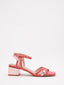Square-heeled sandals in coral and metallic pink