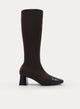Brown high boot with wide heel and patent toe.