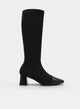 Black high boot with chunky heel and patent toe.