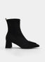 Black ankle boot with wide heel, animal print, and buckle.