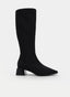 Black high boot with a wide heel and pointed toe.