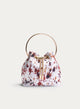 BOLSO BOMBONERA BLANCO VACA CON ASA ARO DORADA