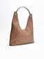 Women's burgundy hobo bag with interior toiletry bag